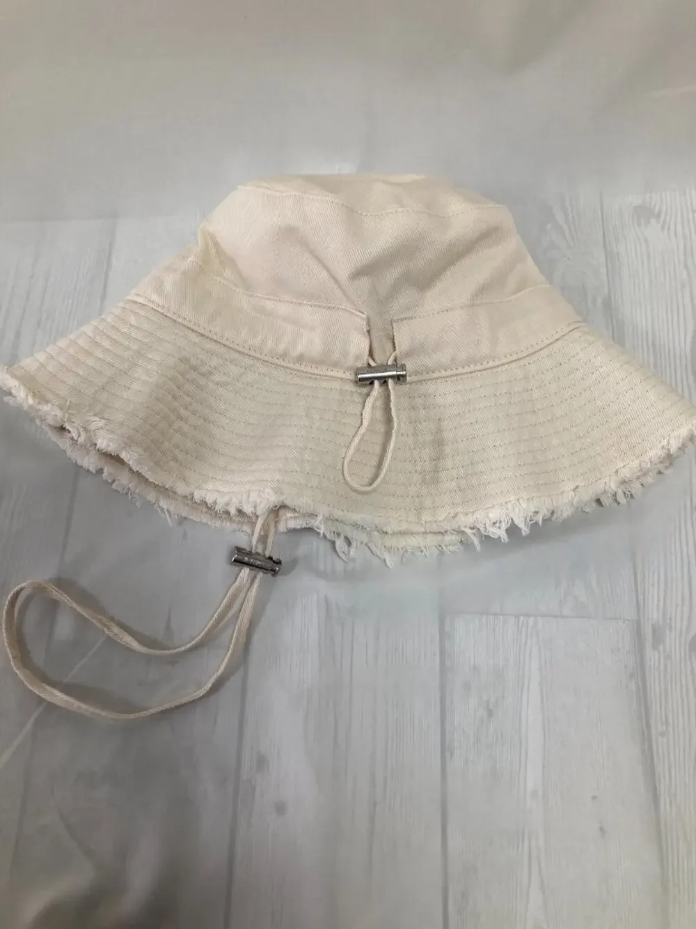 Jacquemus Cream Frayed Brim Bucket Hat Metal Logo Adjustable Chin Strap